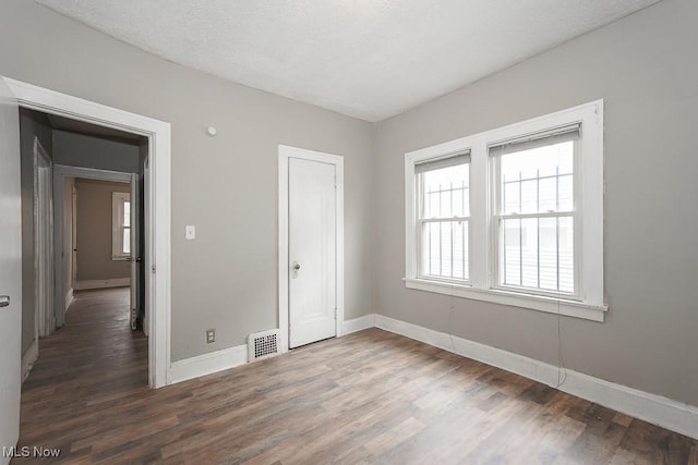 3569 E 154th St, Cleveland, OH 44120 - unfurnished bedroom with wood finished floors and a closet