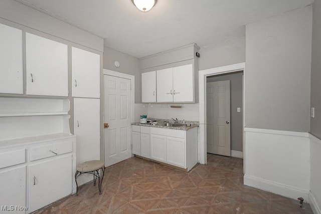 3569 E 154th St, Cleveland, OH 44120 - kitchen featuring white cabinetry and light countertops