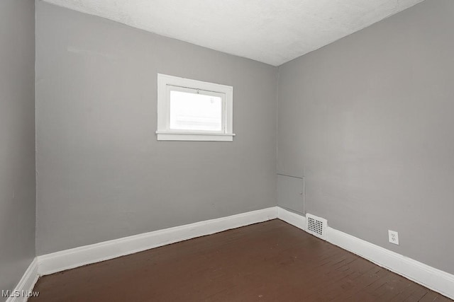 3569 E 154th St, Cleveland, OH 44120 - empty room with baseboards and wood finished floors
