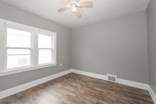 3569 E 154th St, Cleveland, OH 44120 - unfurnished room with dark wood-type flooring and ceiling fan