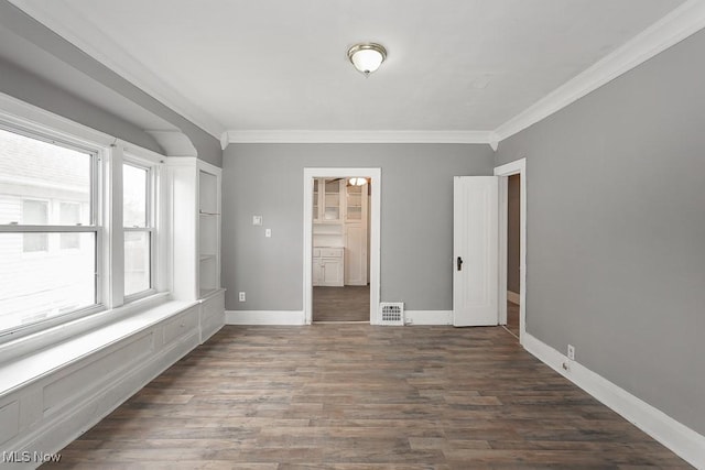 3569 E 154th St, Cleveland, OH 44120 - spare room with ornamental molding and dark wood-type flooring