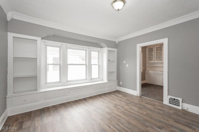 3569 E 154th St, Cleveland, OH 44120 - spare room featuring ornamental molding and wood finished floors