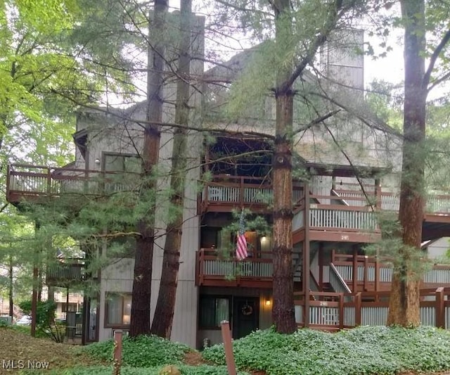 2197 Pinebrook Trl, Cuyahoga Falls, OH 44223 - back of house with a balcony and a chimney