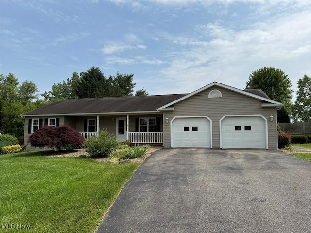 2359 Schellin Rd, Wooster, OH 44691 - single story home with driveway, a garage, a porch, and a front lawn