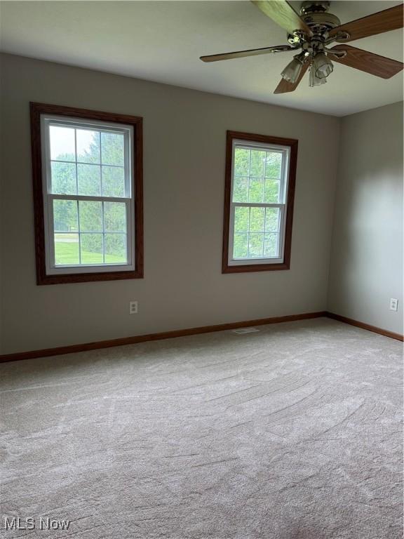 2359 Schellin Rd, Wooster, OH 44691 - carpeted empty room with baseboards and a ceiling fan