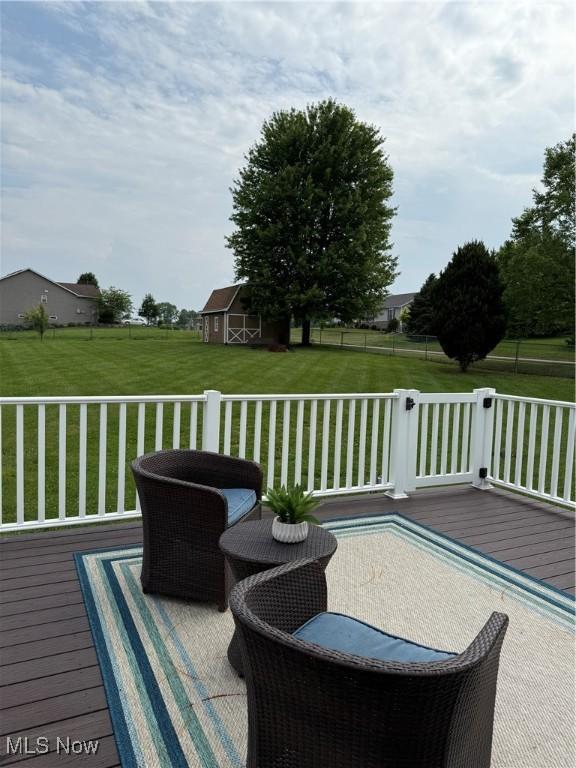 2359 Schellin Rd, Wooster, OH 44691 - wooden deck featuring a lawn and an outbuilding