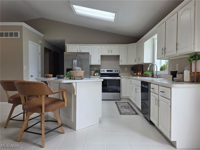 2359 Schellin Rd, Wooster, OH 44691 - kitchen featuring stainless steel appliances, lofted ceiling, white cabinets, and a kitchen island