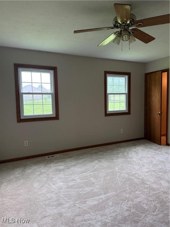 2359 Schellin Rd, Wooster, OH 44691 - carpeted empty room featuring baseboards and a ceiling fan