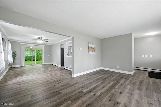 5417 Edgewood Dr, Lorain, OH 44053 - unfurnished living room featuring a baseboard heating unit, dark wood-style floors, a ceiling fan, and crown molding