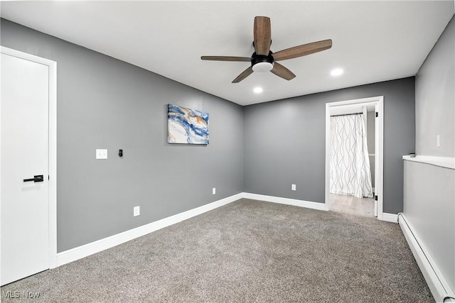 5417 Edgewood Dr, Lorain, OH 44053 - carpeted empty room with a baseboard radiator, ceiling fan, and recessed lighting