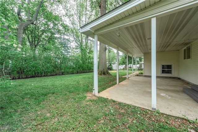 5417 Edgewood Dr, Lorain, OH 44053 - view of grassy yard featuring a carport and a patio