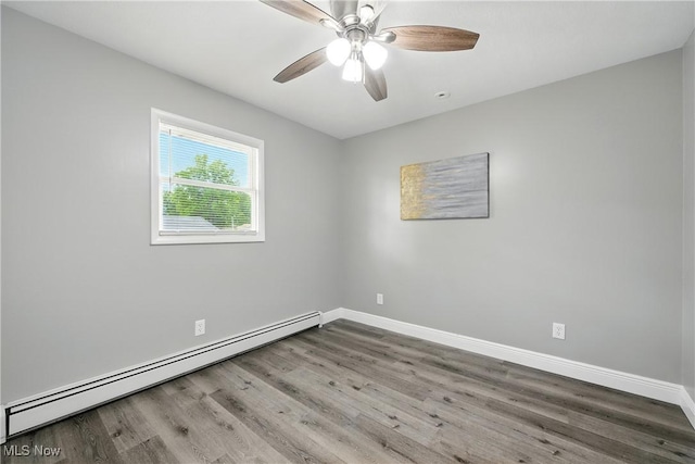 5417 Edgewood Dr, Lorain, OH 44053 - empty room featuring a baseboard radiator, wood finished floors, and ceiling fan