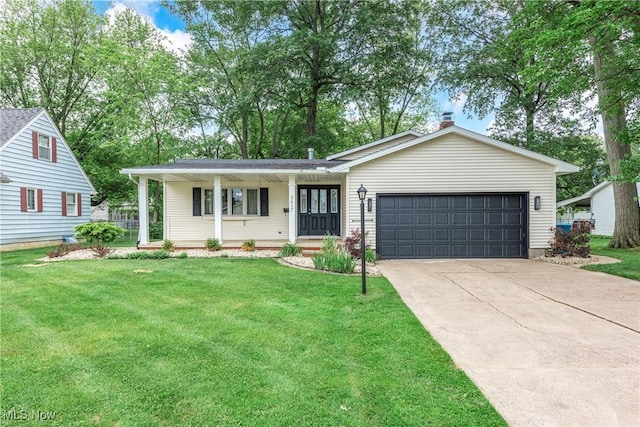 5417 Edgewood Dr, Lorain, OH 44053 - ranch-style house featuring a garage, driveway, and a front lawn