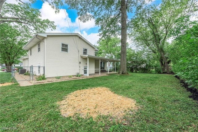5417 Edgewood Dr, Lorain, OH 44053 - rear view of property with a fenced backyard, a gate, and a patio area