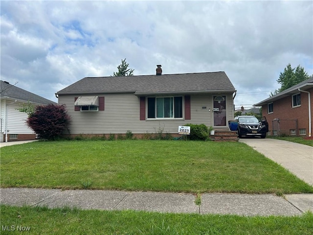 15616 Greendale Rd, Maple Heights, OH 44137 - view of front facade featuring a front lawn, a chimney, driveway, and a shingled roof