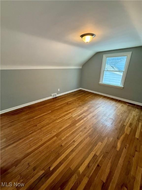 450 E 255th St, Euclid, OH 44132 - additional living space featuring dark wood-style floors and lofted ceiling
