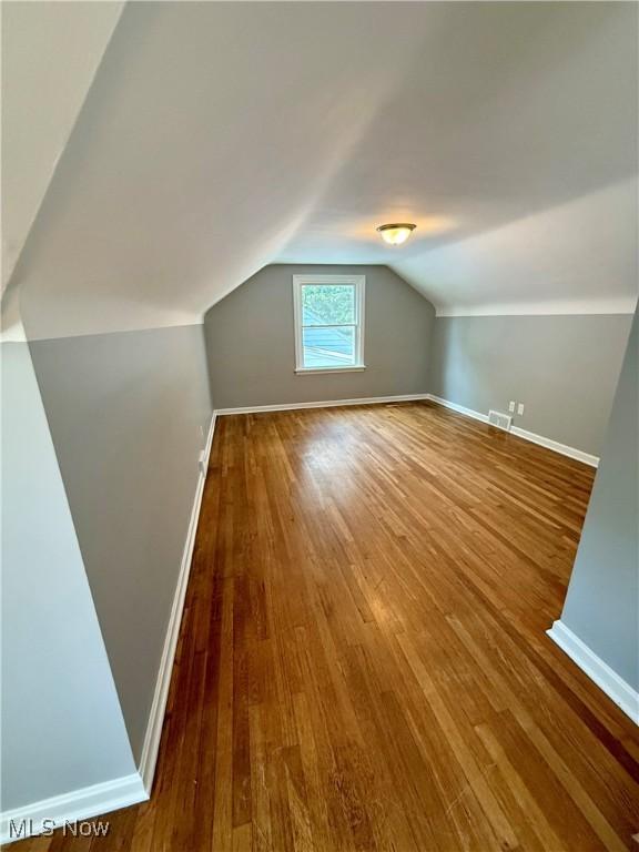 450 E 255th St, Euclid, OH 44132 - additional living space featuring hardwood / wood-style floors and lofted ceiling