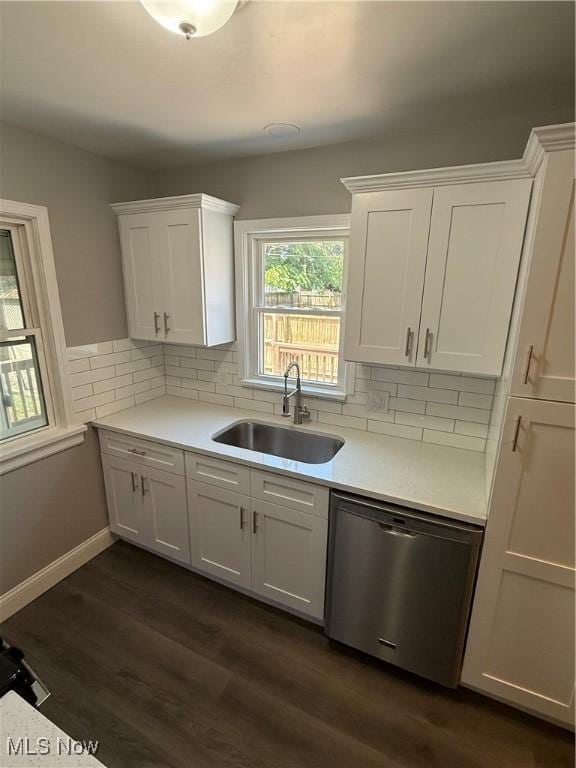 450 E 255th St, Euclid, OH 44132 - kitchen featuring dishwasher, white cabinetry, light countertops, and backsplash