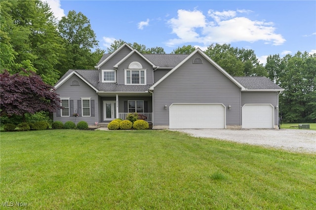 3202 S Lipkey Rd, North Jackson, OH 44451 - view of front of home featuring a porch, driveway, a front yard, an attached garage, and roof with shingles