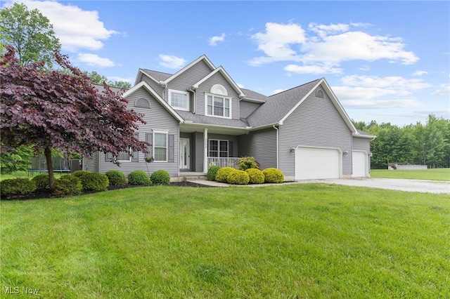 3202 S Lipkey Rd, North Jackson, OH 44451 - traditional home featuring a porch, a front yard, a garage, and driveway