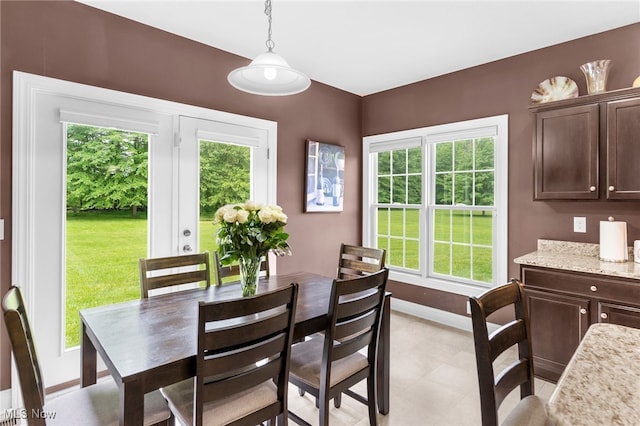 3202 S Lipkey Rd, North Jackson, OH 44451 - dining space with baseboards and light tile patterned floors