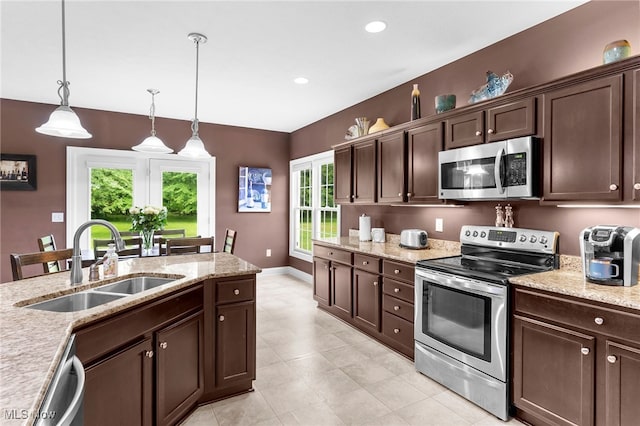 3202 S Lipkey Rd, North Jackson, OH 44451 - kitchen with appliances with stainless steel finishes, dark brown cabinets, pendant lighting, light tile patterned floors, and light stone countertops