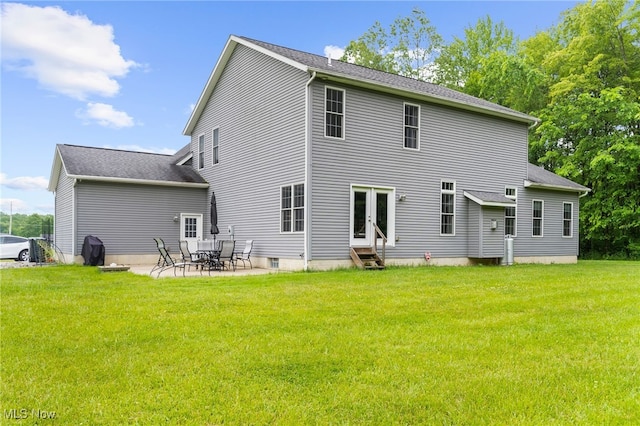 3202 S Lipkey Rd, North Jackson, OH 44451 - back of property with entry steps, a lawn, a patio area, and french doors