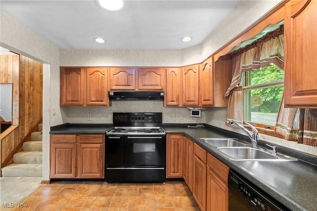 53979 Colerain Pike, Martins Ferry, OH 43935 - kitchen with black appliances, under cabinet range hood, dark countertops, and brown cabinetry