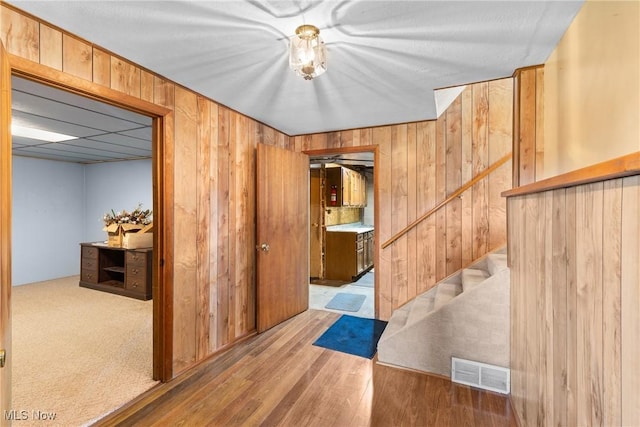 53979 Colerain Pike, Martins Ferry, OH 43935 - interior space with wooden walls, wood finished floors, and stairway