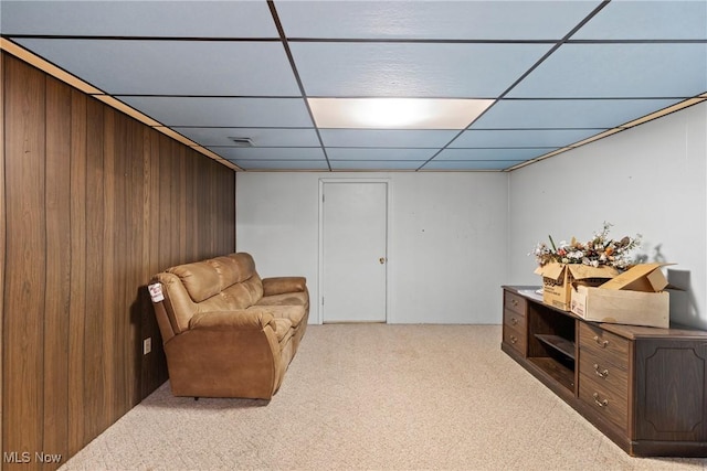 53979 Colerain Pike, Martins Ferry, OH 43935 - living area featuring a drop ceiling, light carpet, and wooden walls