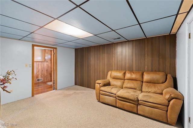 53979 Colerain Pike, Martins Ferry, OH 43935 - carpeted living area featuring wood walls and a drop ceiling
