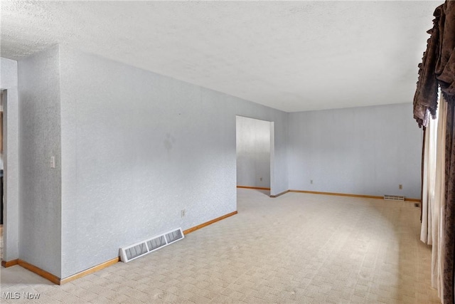 53979 Colerain Pike, Martins Ferry, OH 43935 - spare room featuring light colored carpet, a textured wall, and a textured ceiling