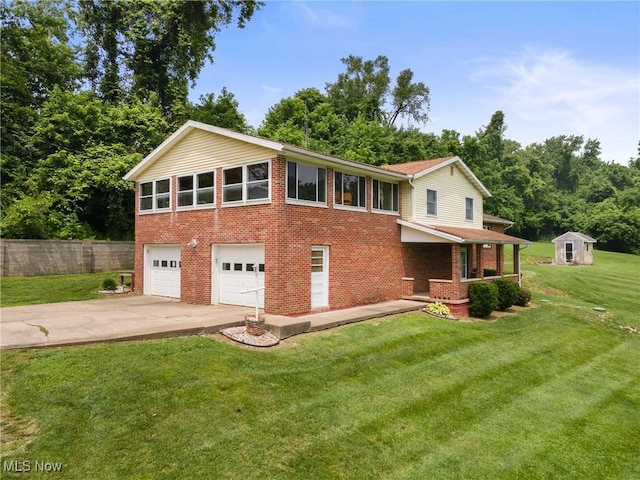 53979 Colerain Pike, Martins Ferry, OH 43935 - view of front of house featuring brick siding, concrete driveway, a garage, and a storage unit