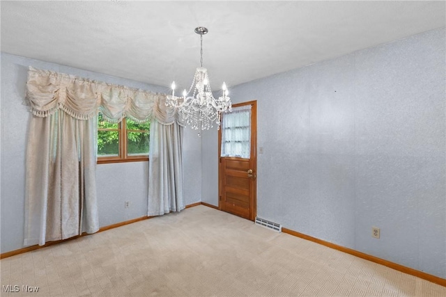 53979 Colerain Pike, Martins Ferry, OH 43935 - carpeted spare room featuring a chandelier and baseboards