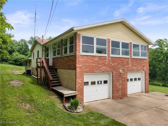 53979 Colerain Pike, Martins Ferry, OH 43935 - view of side of property with brick siding, concrete driveway, and a yard