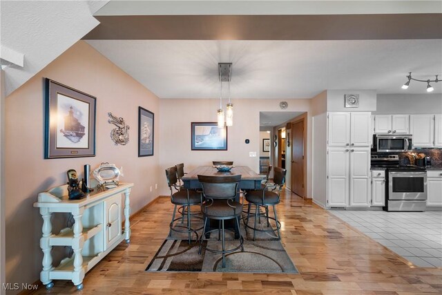 4869 Coleman Dr, Akron, OH 44319 - dining room featuring light wood finished floors and baseboards