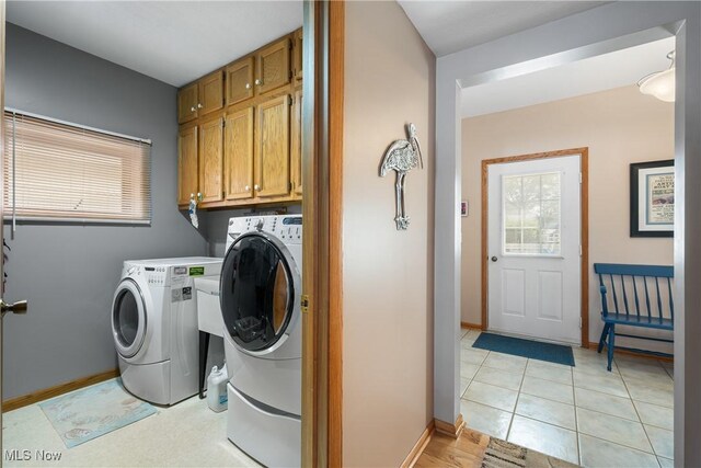 4869 Coleman Dr, Akron, OH 44319 - washroom featuring washing machine and dryer and cabinet space