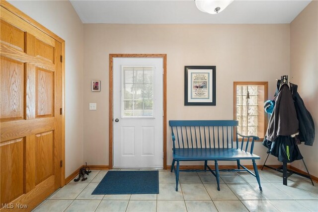 4869 Coleman Dr, Akron, OH 44319 - foyer entrance with light tile patterned floors and baseboards