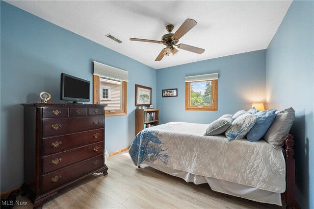 4869 Coleman Dr, Akron, OH 44319 - bedroom with wood finished floors and a ceiling fan