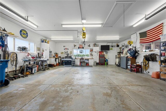 4869 Coleman Dr, Akron, OH 44319 - garage featuring a workshop area