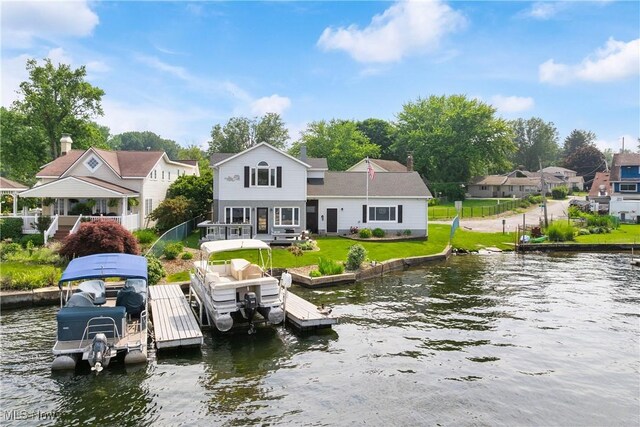 4869 Coleman Dr, Akron, OH 44319 - dock area featuring boat lift, a water view, and a lawn