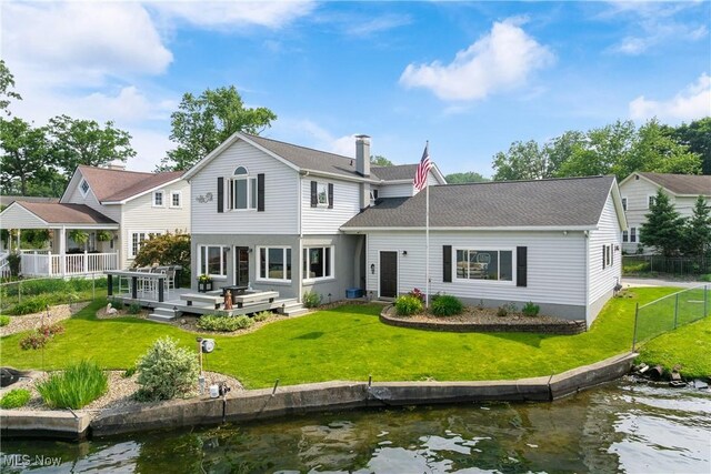 4869 Coleman Dr, Akron, OH 44319 - back of property featuring a deck with water view