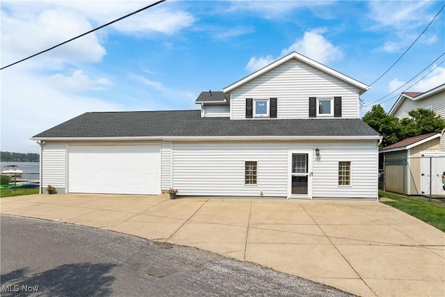 4869 Coleman Dr, Akron, OH 44319 - view of front of home with a garage and a shingled roof