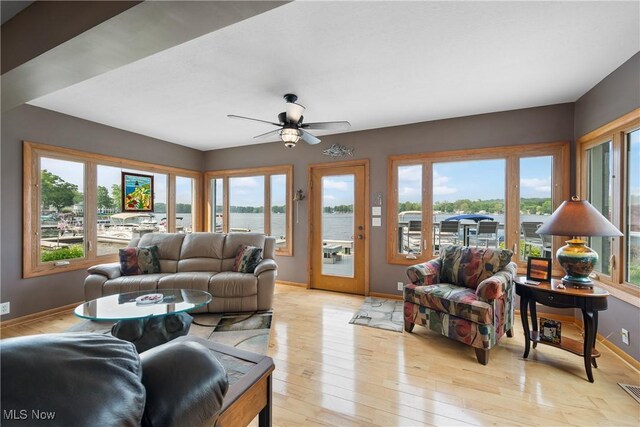 4869 Coleman Dr, Akron, OH 44319 - living area with ceiling fan, light wood-type flooring, and a water view