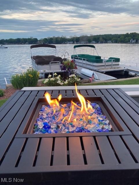 4869 Coleman Dr, Akron, OH 44319 - exterior space with a fire pit, a water view, and a boat dock