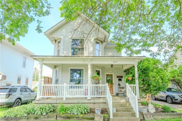 820 Walnut St, Caldwell, OH 43724 - view of front facade with a porch