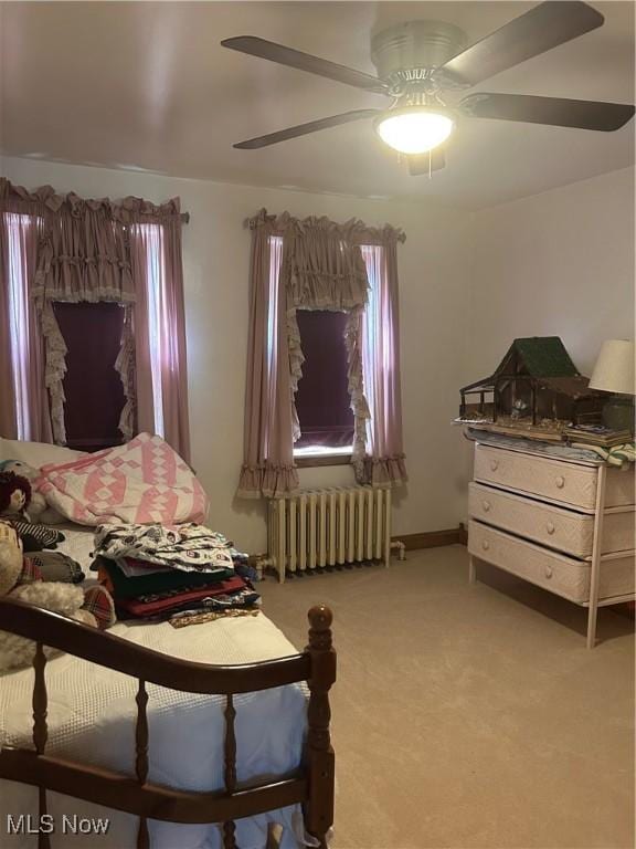 3601 State St, Weirton, WV 26062 - bedroom with radiator heating unit, carpet, ceiling fan, and multiple windows