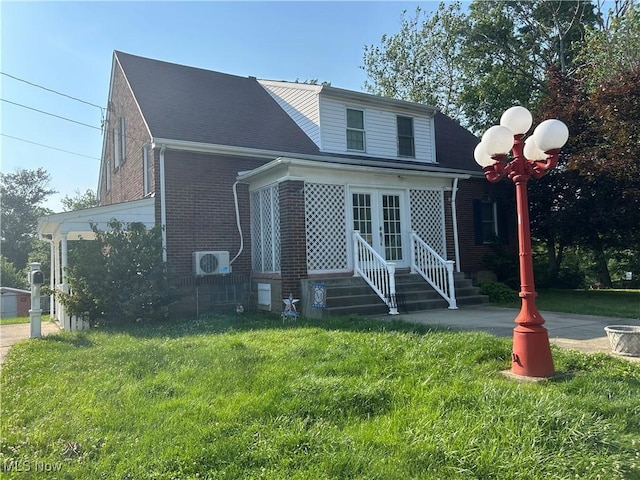 3601 State St, Weirton, WV 26062 - bungalow with brick siding, french doors, a front yard, and roof with shingles