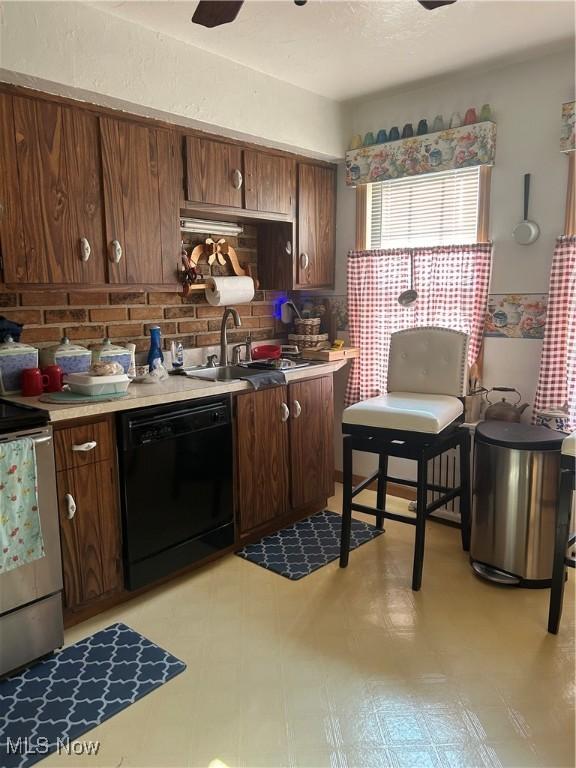 3601 State St, Weirton, WV 26062 - kitchen featuring black dishwasher, stainless steel range with electric stovetop, light countertops, and decorative backsplash