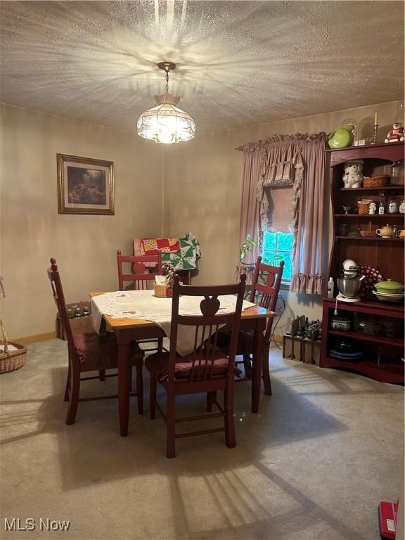 3601 State St, Weirton, WV 26062 - carpeted dining area featuring a textured ceiling